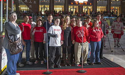 Best Buddies Friends Choir performing the national anthem at a Miami Hockey game